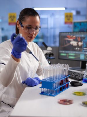 chemist-researcher-dropping-liquid-medical-glassware-using-micropipette_482257-20231